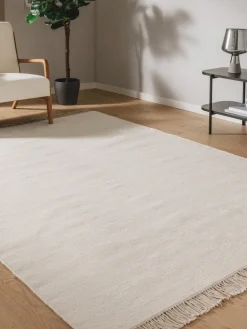 Alfombra artesanal de lana con flecos Liv