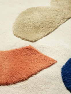 Alfombra infantil artesanal redonda con relieves Panto