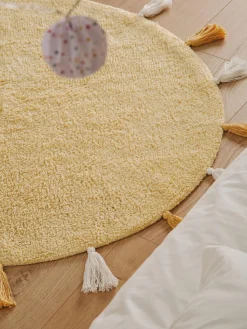 Alfombra infantil redonda artesanal de algodón con borlas Malu
