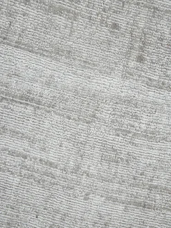 Alfombra redonda artesanal de viscosa Jane