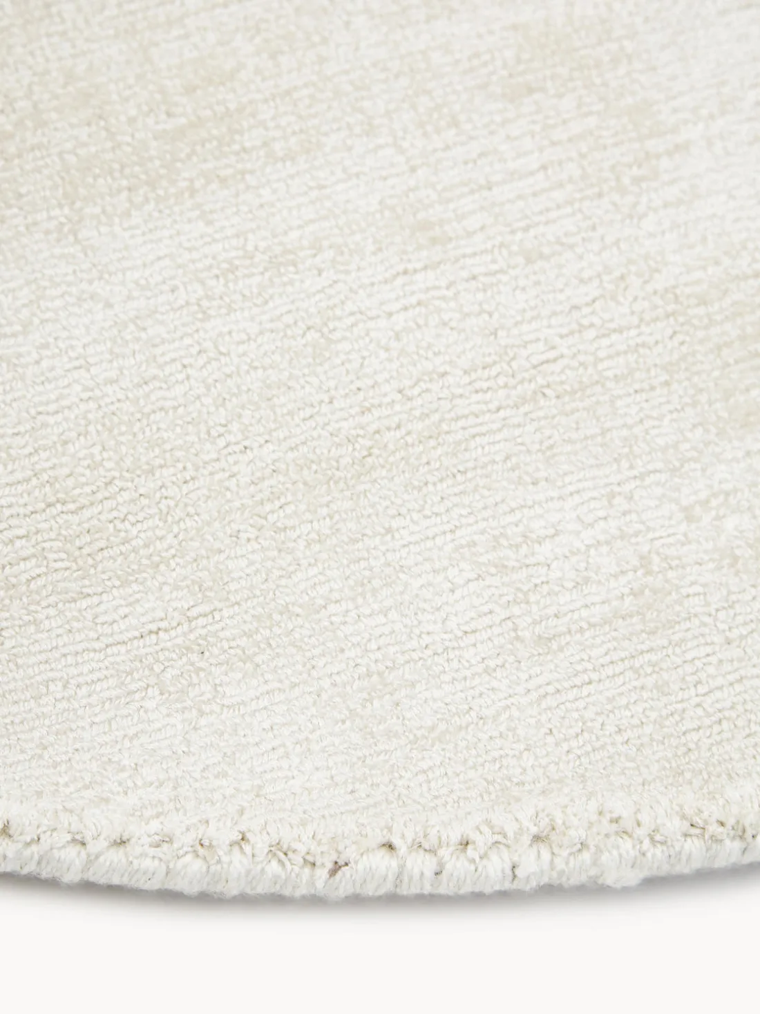 Alfombra redonda artesanal de viscosa Jane