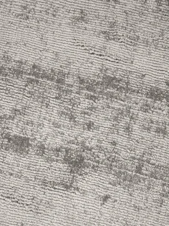 Alfombra redonda artesanal de viscosa Jane