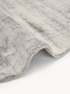 Alfombra redonda artesanal de viscosa Jane