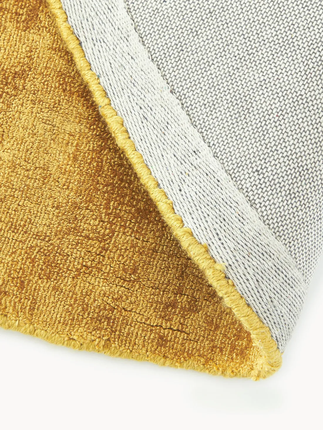 Alfombra redonda artesanal de viscosa Jane