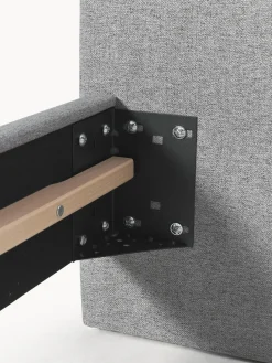 Cama tapizada con patas de madera Giulia