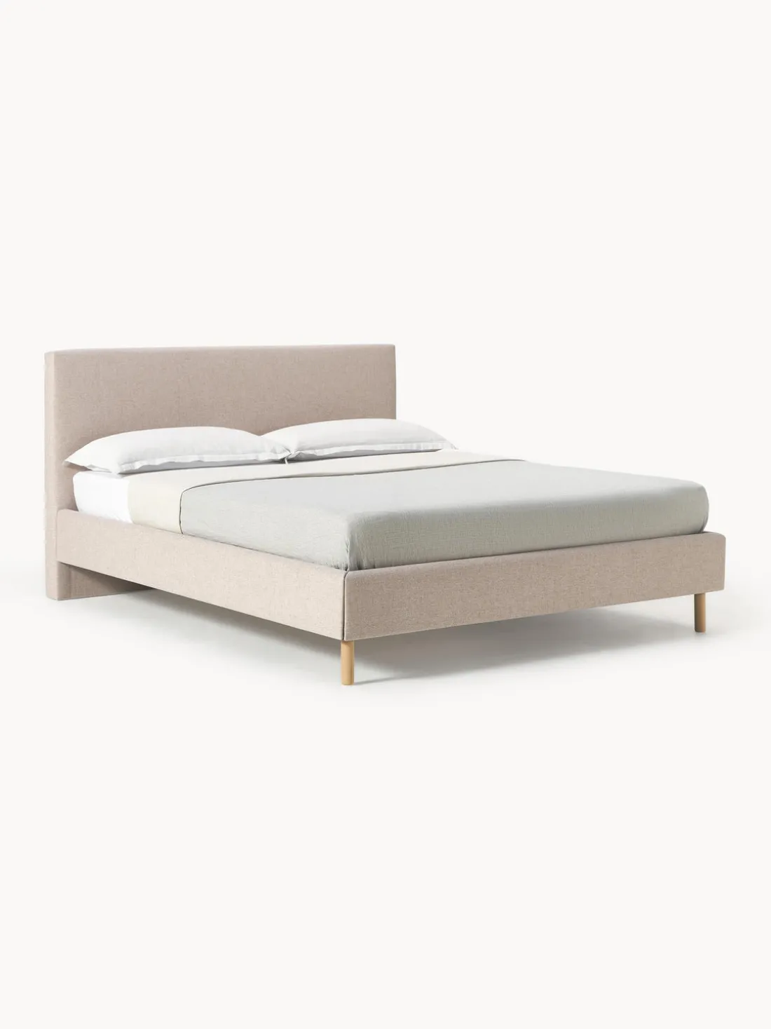 Cama tapizada con patas de madera Giulia