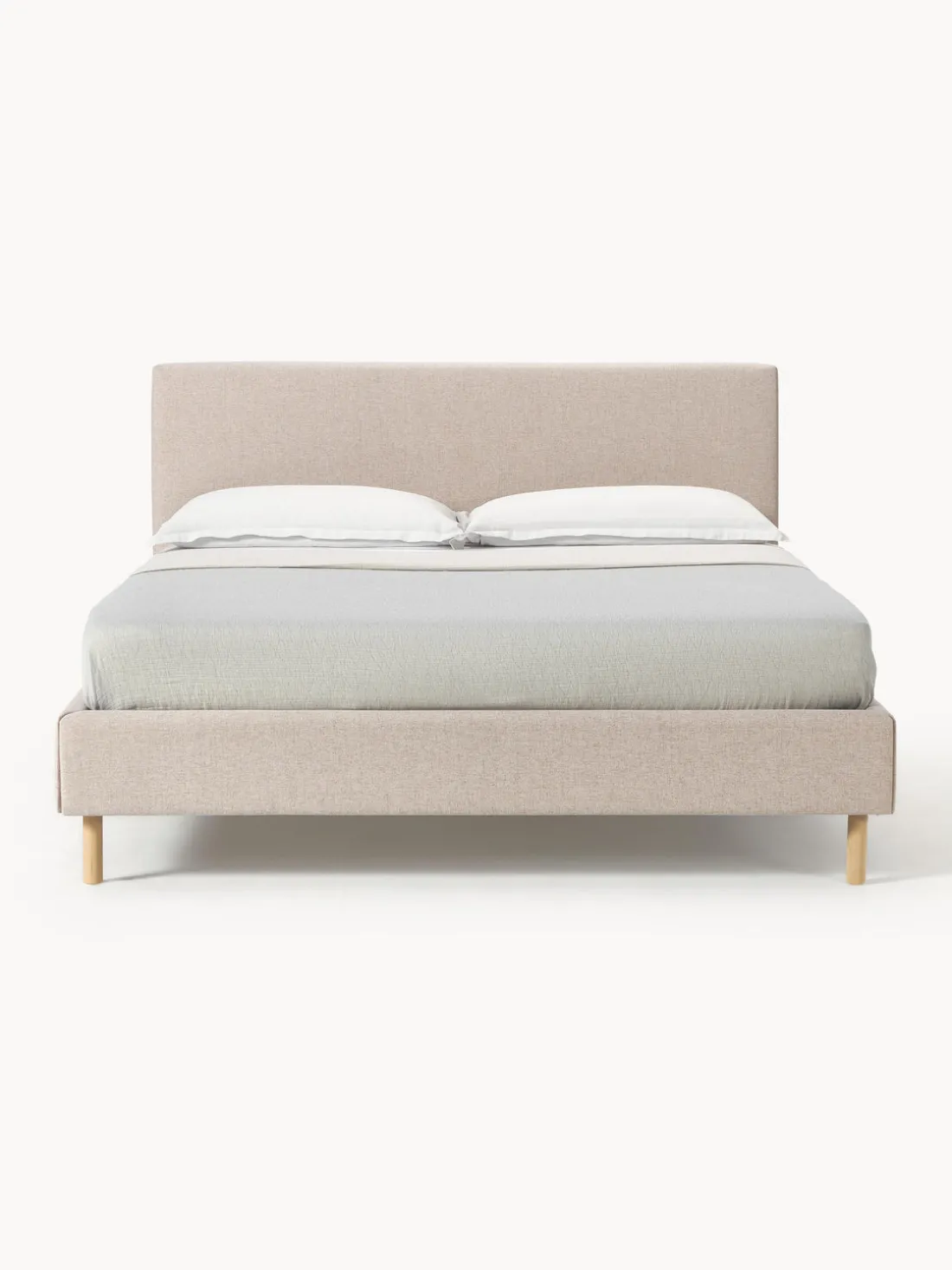 Cama tapizada con patas de madera Giulia