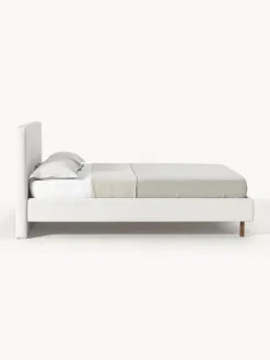 Cama tapizada con patas de madera Giulia