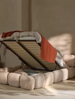 Cama tapizada en tejido bouclé con espacio de almacenamiento Tayla