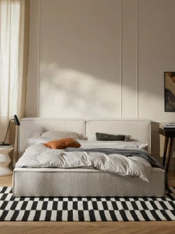 Cama tapizada en tejido bouclé Lennon, con espacio de almacenamiento