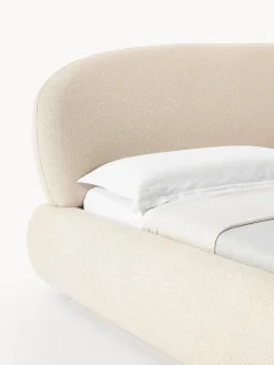 Cama tapizada redondeada en tejido bouclé Alba