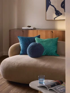 Cojín esférico de borreguillo Dotty