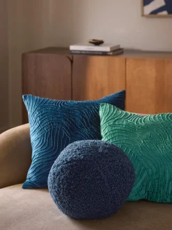 Cojín esférico de borreguillo Dotty