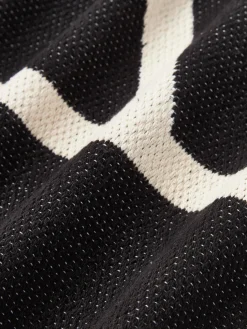 Funda de cojín artesanal con motivos geométricos Asta