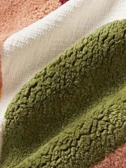 Funda de cojín capitoné con mechones decorativos Malu