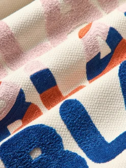 Funda de cojín reversible con inscripción bordada Blah Blah