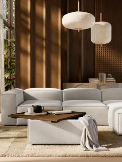 Reposapiés puf en tejido bouclé con espacio de almacenamiento Lennon