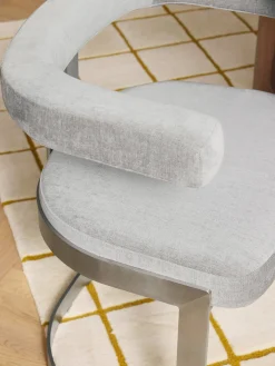 Silla cantilever tapizada Gianni