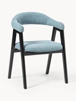 Silla con reposabrazos tapizada en tejido bouclé Nik