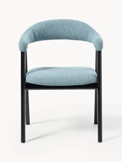 Silla con reposabrazos tapizada en tejido bouclé Nik