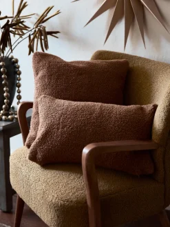 Sillón de borreguillo con reposabrazos Moritz