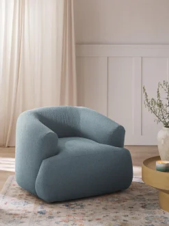 Sillón en tejido bouclé Sofia