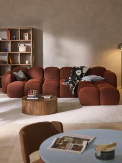 Sofá modular en tejido bouclé con reposapiés Tayla (4 plazas)