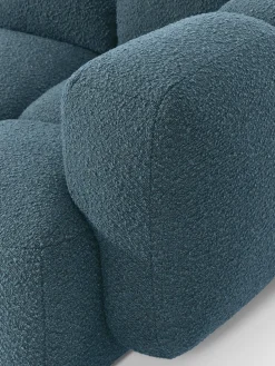 Sofá modular en tejido bouclé con reposapiés Tayla (4 plazas)