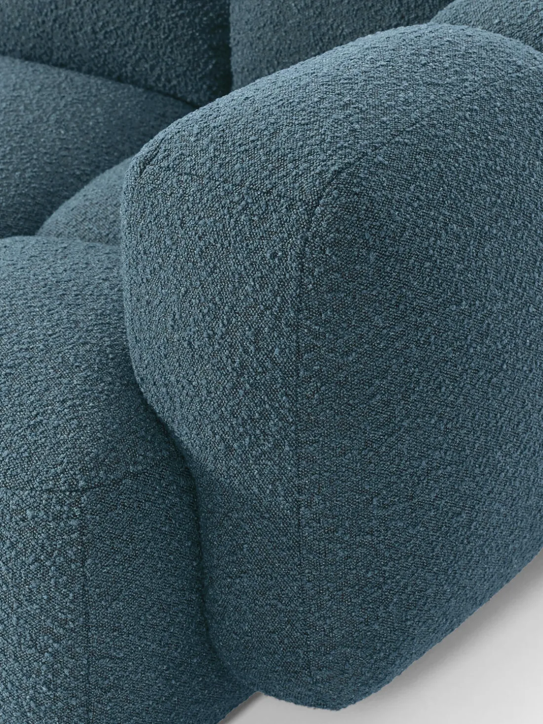 Sofá modular en tejido bouclé con reposapiés Tayla (4 plazas)