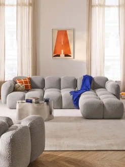 Sofá modular en tejido bouclé con reposapiés Tayla (4 plazas)