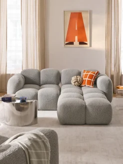 Sofá modular en tejido bouclé con reposapiés Tayla (3 plazas)