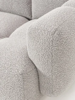 Sofá modular en tejido bouclé con reposapiés Tayla (3 plazas)