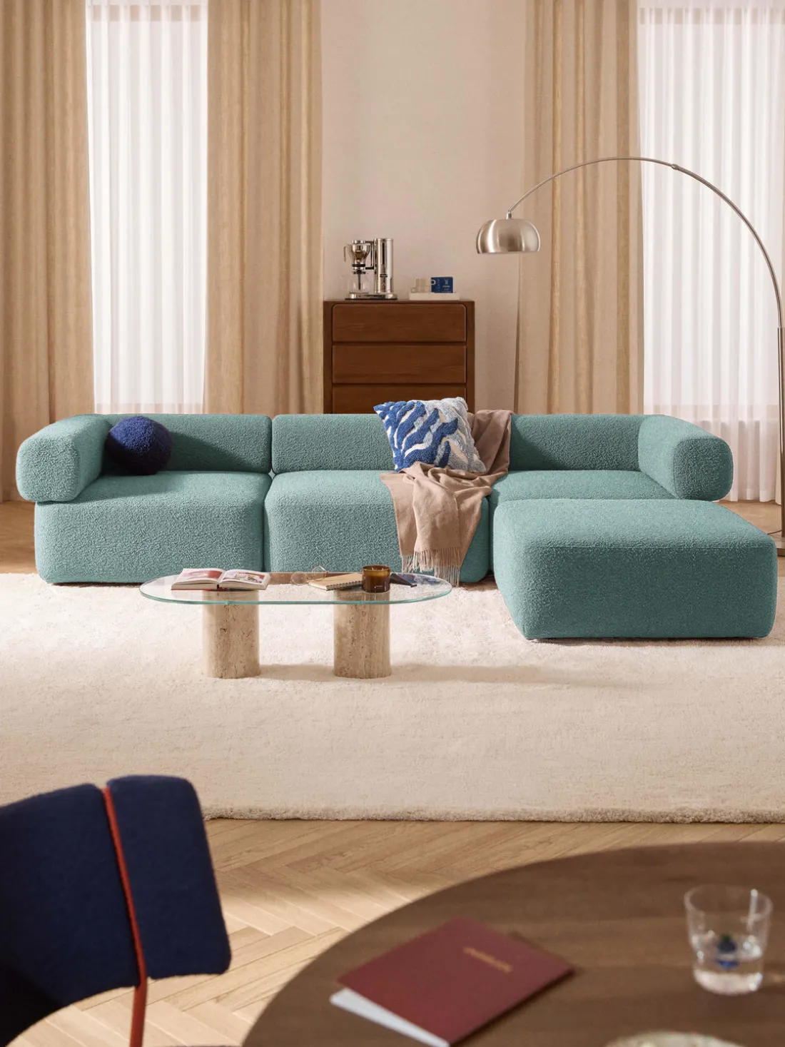 Sofá modular en tejido bouclé Anton (4 plazas), con reposapiés (izquierda/derecha)