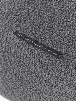 Westwing | Crosby Studios, cojín redondo en tejido bouclé Celeste, Ø 70 cm